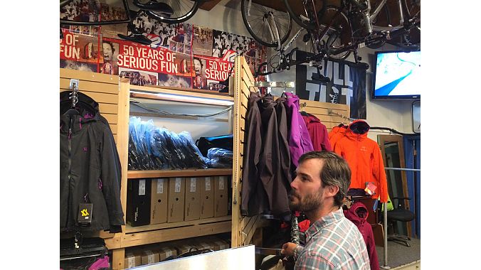At Alpine Hut, owner Kyle Fisher has the difficult task of maintaining a ski and bike shop virtually year round in a small space. One trick? Fisher built this ski boot storage area hidden behind a clothes display.