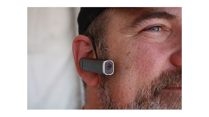 Jay Moore demonstrates the Looxcie, a tiny camera that can stream live video to your Facebook page. The camera sells for $149 to $179, depending on model, and weighs less than 30 grams. It can mount to a helmet, your ear or a hat brim. 