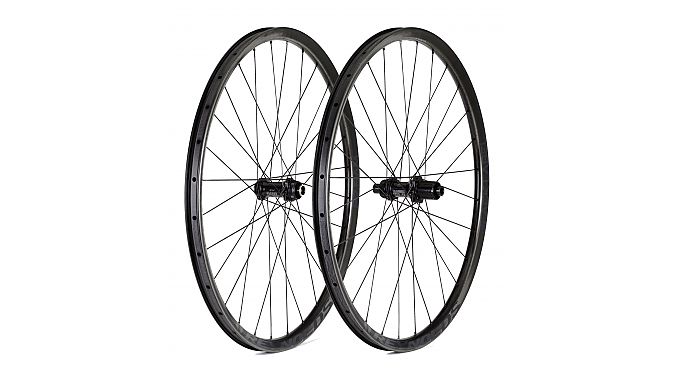 BlackLabel carbon wheelsets get sublimated black-on-black graphics and are built around DT Swiss hubs