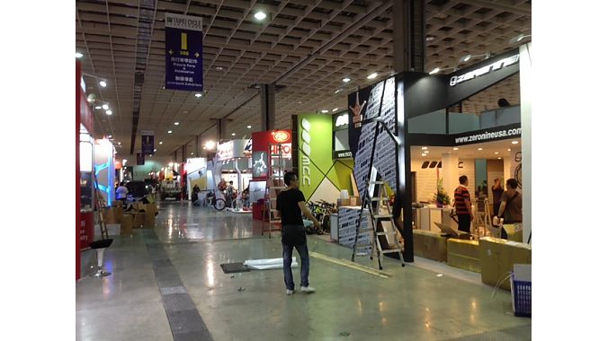 Exhibitors set up Tuesday at Nangang Exhibition Hall.