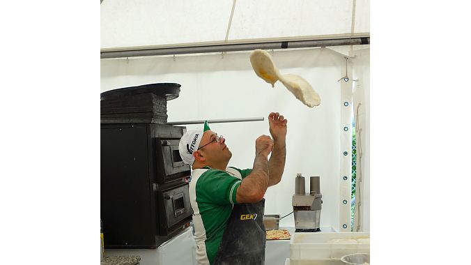 Vittoria tire sponsored a pizza and vino operation at the outdoor demo. This guy could throw dough into a rectangular shape with amazing facility - and a smile.