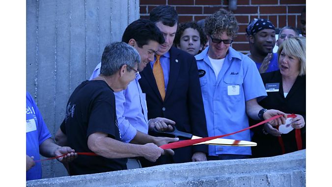 First row, from left: Sherry Little, Catrike master welder, Paulo Camasmie (founder), Orlando City Commissioner Robert Stuart, Mark Egeland (Catrike general manager), Sherry Reeves (MACF).