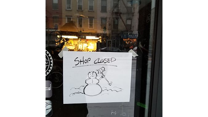 A mad snowman greets customers at 718 Cyclery.