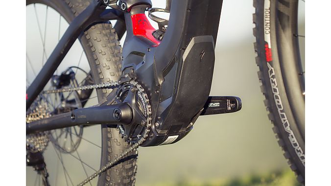 A rock guard protects the battery and motor from debris on the trail. 