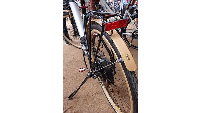 Flitzbike has got a lock on the market for wooden-rimmed, electric, Gates belt-driven city bikes. It has wooden handlebars and fenders, too