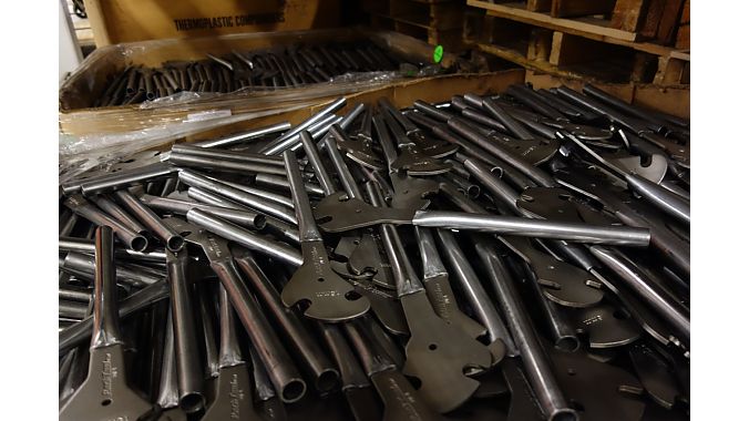 A bin of pedal wrenches mid-production.
