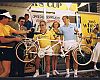 At the 1985 Beverly Hills Celebrity Bike Race, Cohen (center) presents a Kuwahara tandem to race winner Kiki Vandeweghe (far right) of the Los Angeles Lakers. This small tandem was later exchanged for a larger bike to fit the 6-foot-8 Vandeweghe.