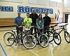  Grand prize bike winners receiving their Raleigh bicycles. From left to right: Scott Cowan (owner of Century Cycles), winner Emma Keane, Chris Speyer (COO of Accell North America), winner Bridget Murphy, and Sean Burkey (Midwest Rep for Raleigh Bicycles). 