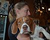 Karen Muehl, wife of Uptown Cycles owner Chris Sheehan, snuggles with Wallace, one of the retailer's two shop dogs. Wallace entertained the Dealer Tour crew with his playful antics during our visit Monday.