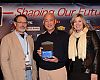 BRAIN publisher Marc Sani presents the international supplier of the year award to Giant Global's Tony Lo. Giant USA general manager Elysa Walk introduced Lo. 