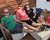 A few of the Ladies of Dealer Tour take advantage of the front patio at Division 1. BRAIN’s Val Vanderpool (left) and Megan Tompkins flank Bell Helmets’ Kristin Michal.