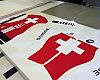 Assos manufactures custom team kit and prototypes in Stabio. This sublimated fabric was being cut for the Swiss world championships team.