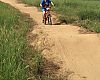 A young ripper lays down a lap in the pump track below the expo area and campground.