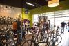Customers mingle at the grand opening party at Cadence Cyclery's new store. Customers mingle at the grand opening party at Cadence Cyclery's new store.