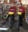 Taylor and Davis Phinney aboard e-bikes. Taylor and Davis Phinney aboard e-bikes.