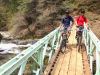 Jet Lites owners Mike Henderson, left, and Jim Scripps take a bridge break near Downieville, California