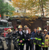 Fire officials speak to the media following Saturday's fire. FDNY Instagram photo.