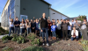Emerson, front, with employees at the Light & Motion factory. Emerson, front, with employees at the Light & Motion factory.